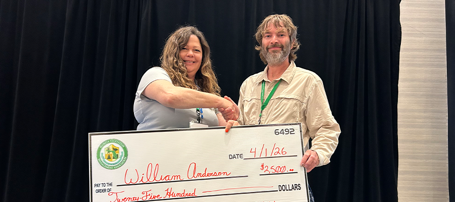 William Anderson accepts the FVMA Scholarship award during the Florida Vegetation Management Association conference.